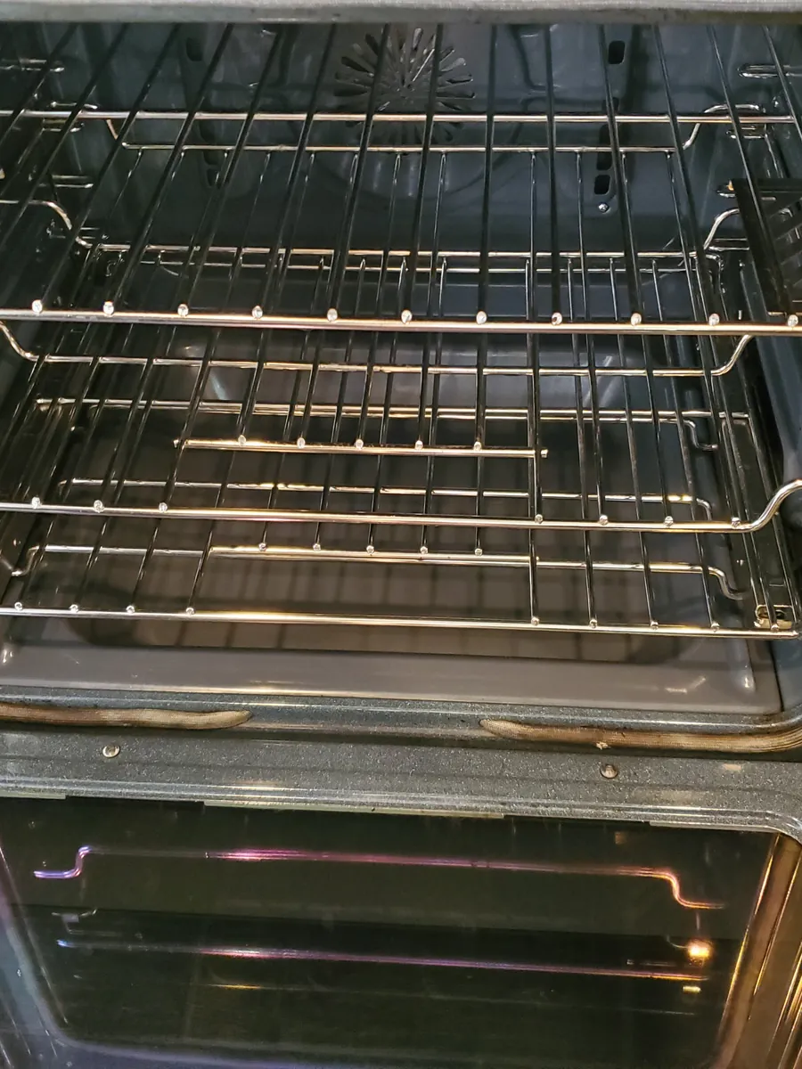 Oven interior after cleaning, with gleaming racks and a spotless door