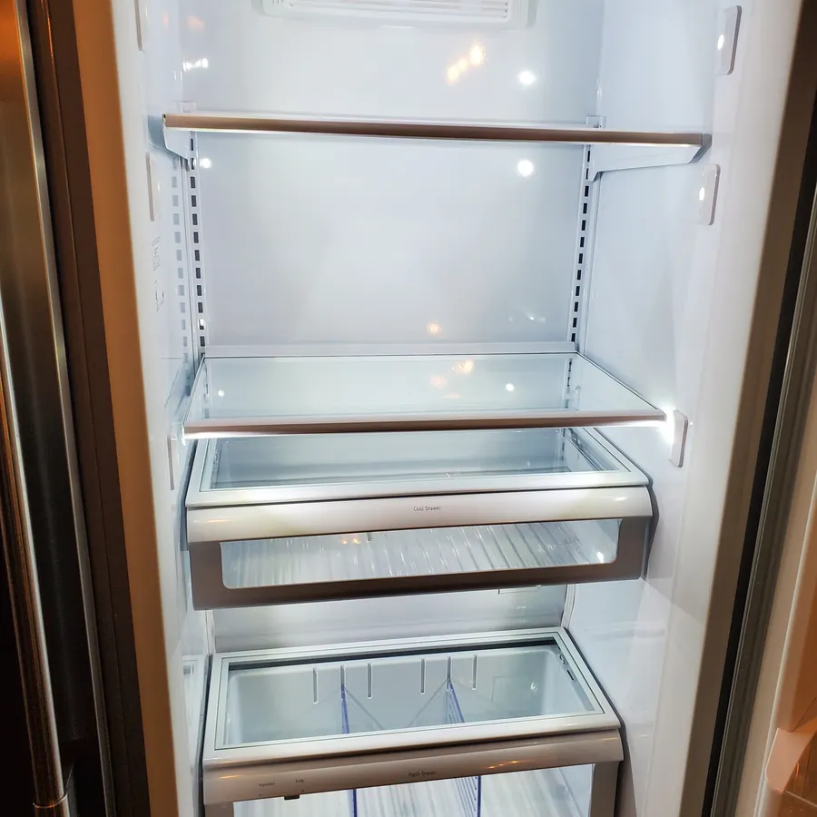 Refrigerator interior after cleaning, with clear shelves and drawers