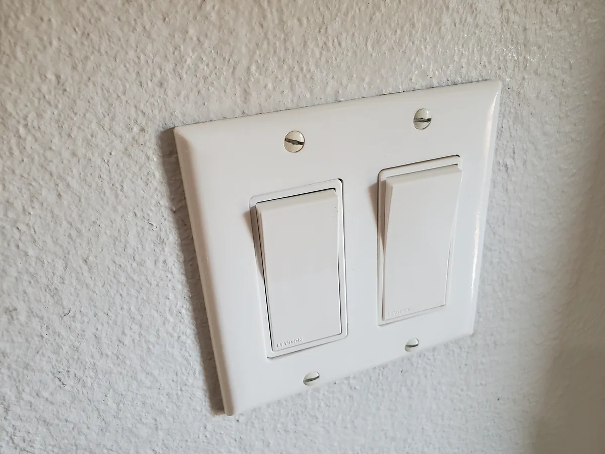 Light switch cover after cleaning, bright white