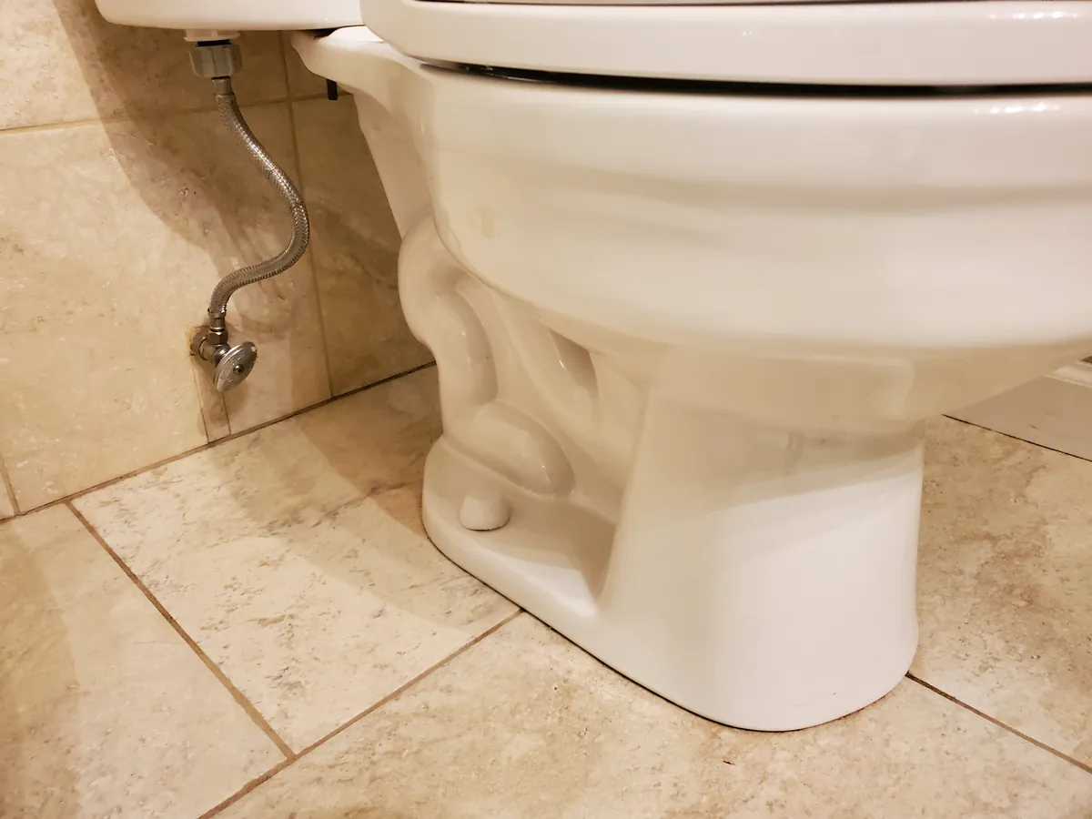 Toilet base and floor after cleaning, spotless