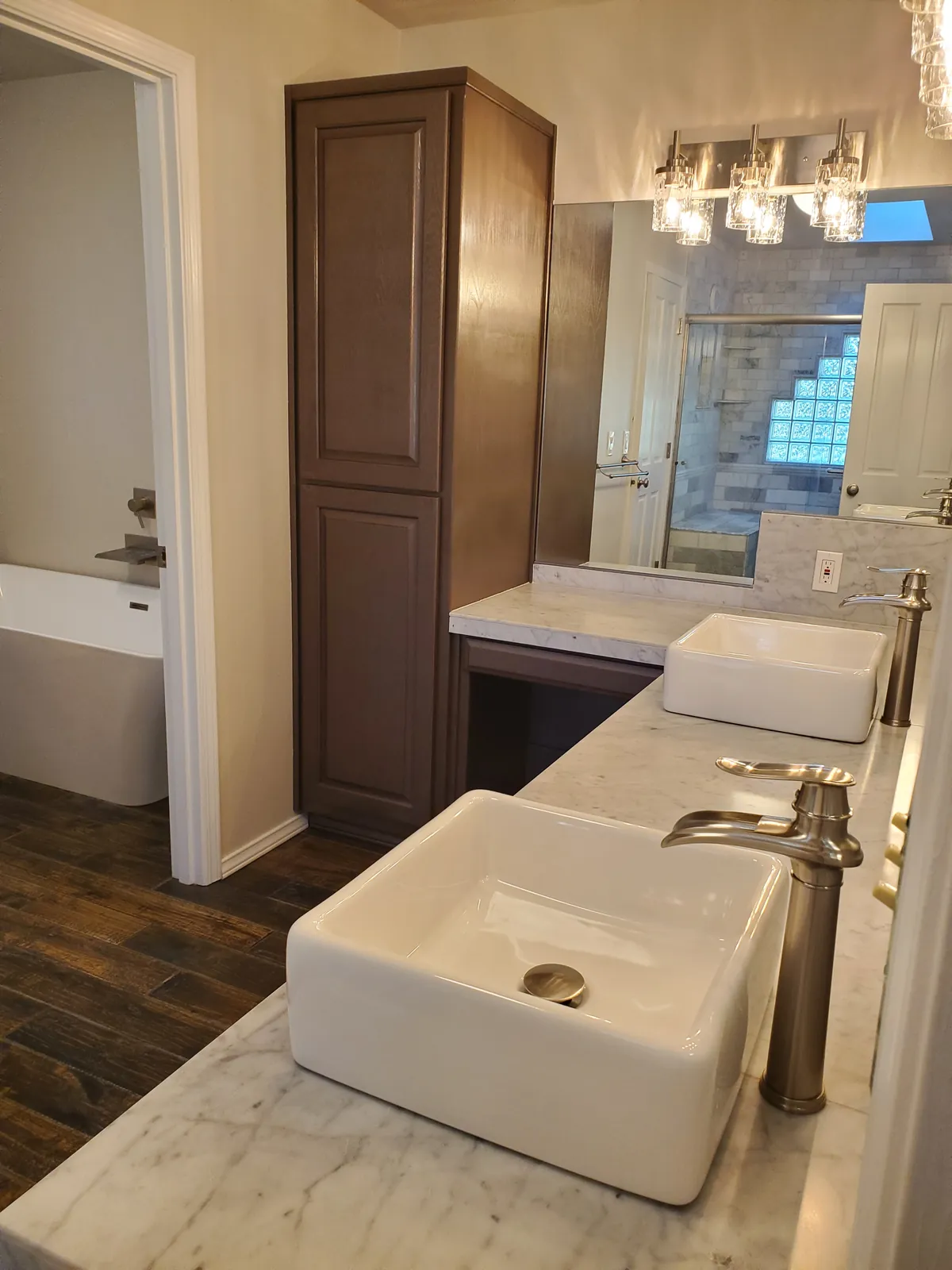 Bathroom vanity after a clean, with vessel sinks and a polished counter