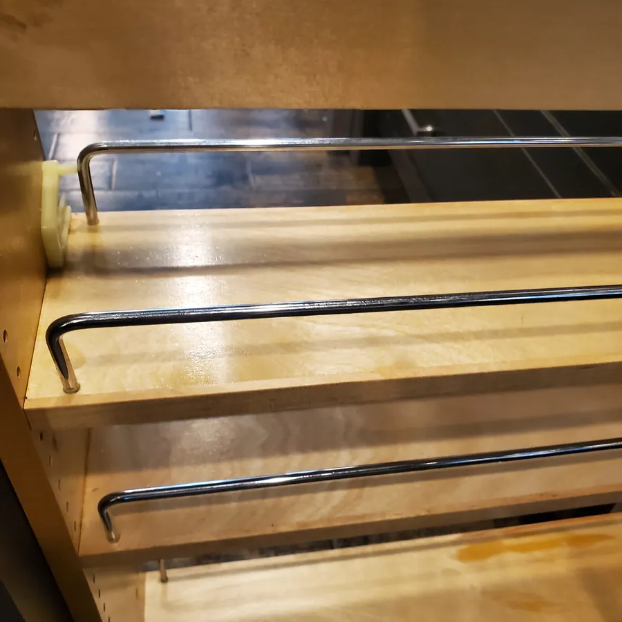 Pull-out spice cabinet after cleaning, wiped clean
